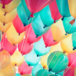 Colorful balloons with happy celebration party background