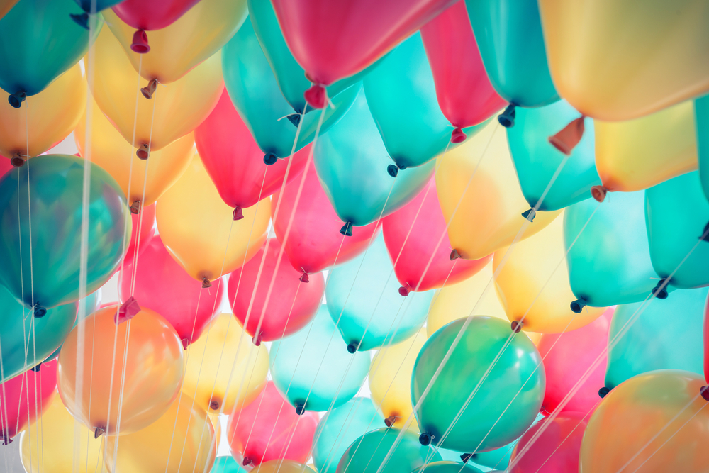 Colorful balloons with happy celebration party background